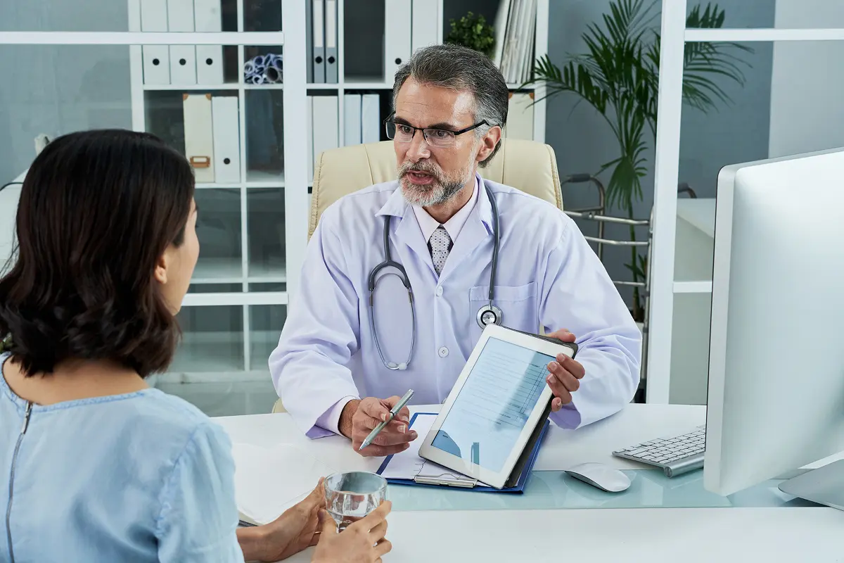 A woman consulting the doctor for health issues