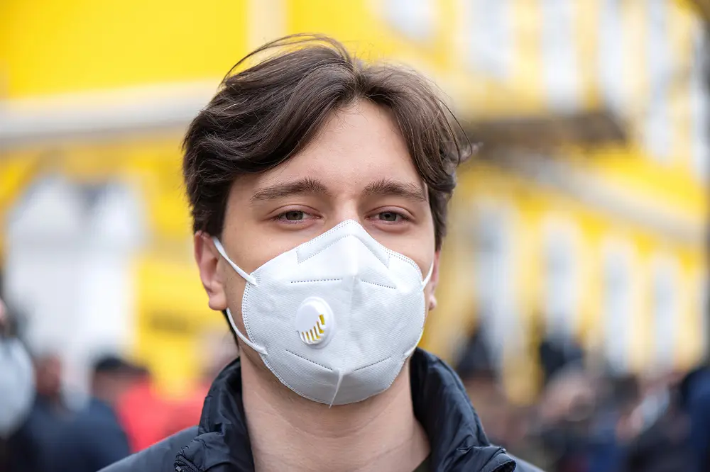 A man with air pollution mask for protect from air pollution